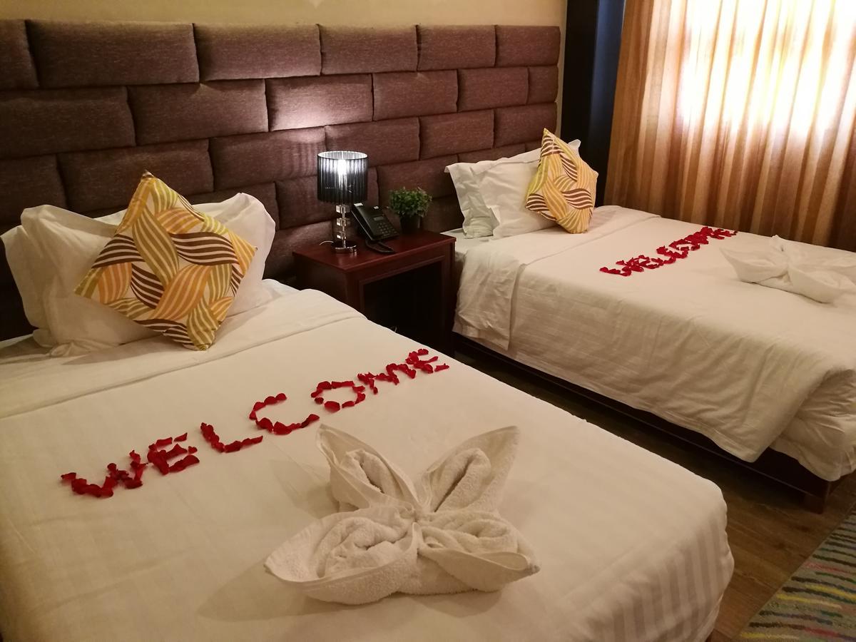 Great Wall Hotel Daressalam Zimmer foto